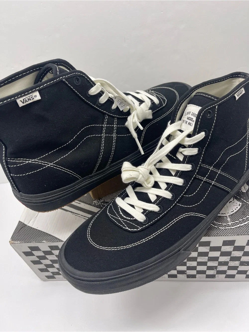 Vans Men’s High-Top Canvas Sneakers in Black and White